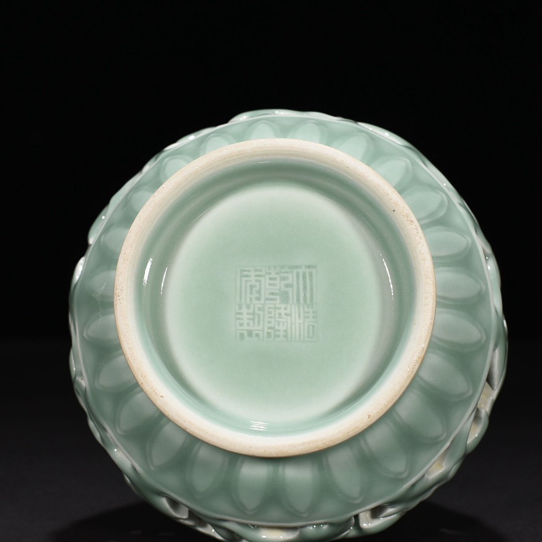 Qing Dynasty Qianlong pink celadon glaze hollow vase with entwined branches and floral patterns