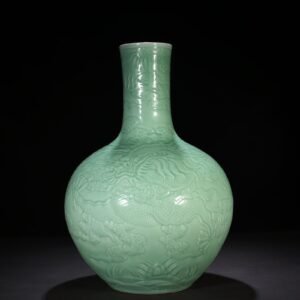 Qing Dynasty Qianlong pink celadon glaze carved cloud and dragon pattern celestial sphere vase