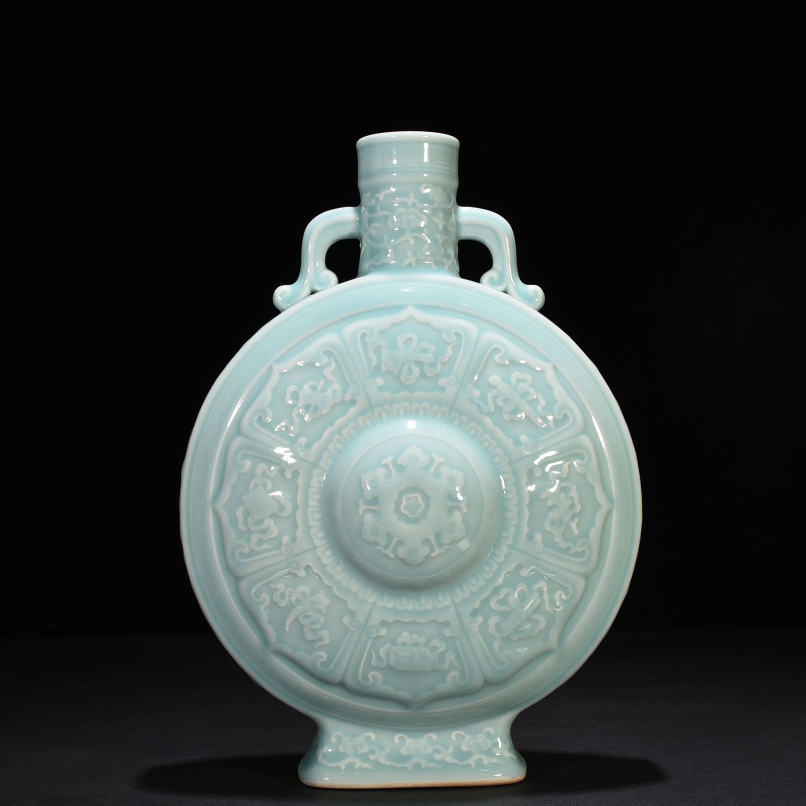Qing Dynasty Qianlong pink celadon glaze carved eight-treasure pattern moon bottle flat bottle