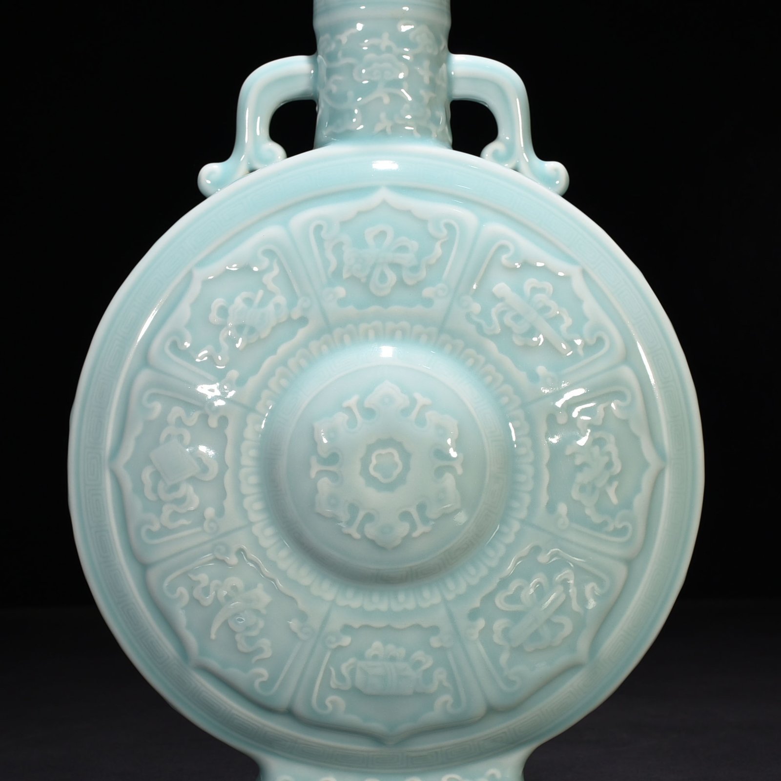 Qing Dynasty Qianlong pink celadon glaze carved eight-treasure pattern moon bottle flat bottle
