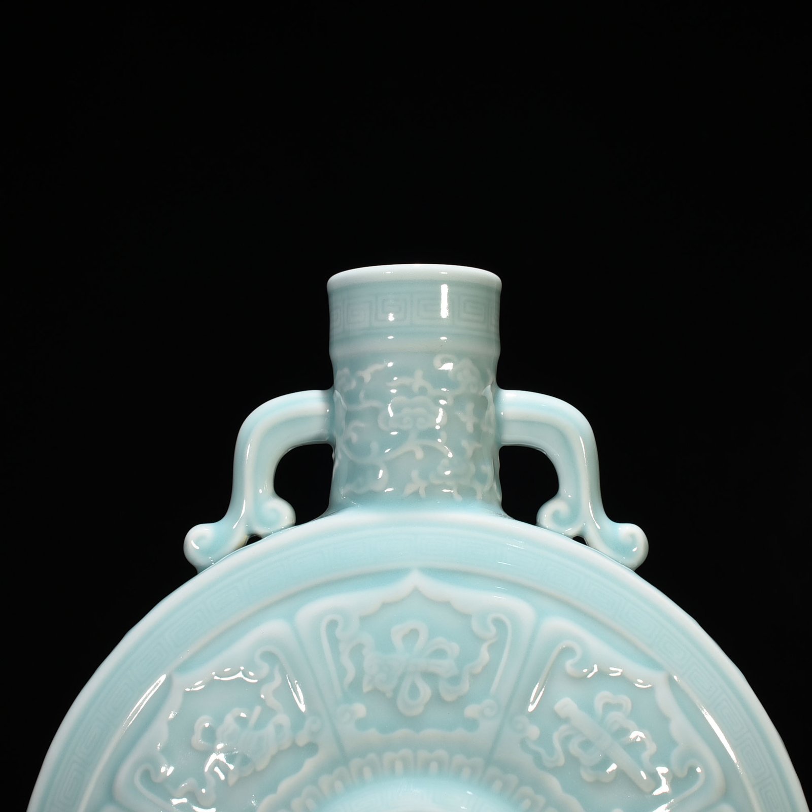 Qing Dynasty Qianlong pink celadon glaze carved eight-treasure pattern moon bottle flat bottle