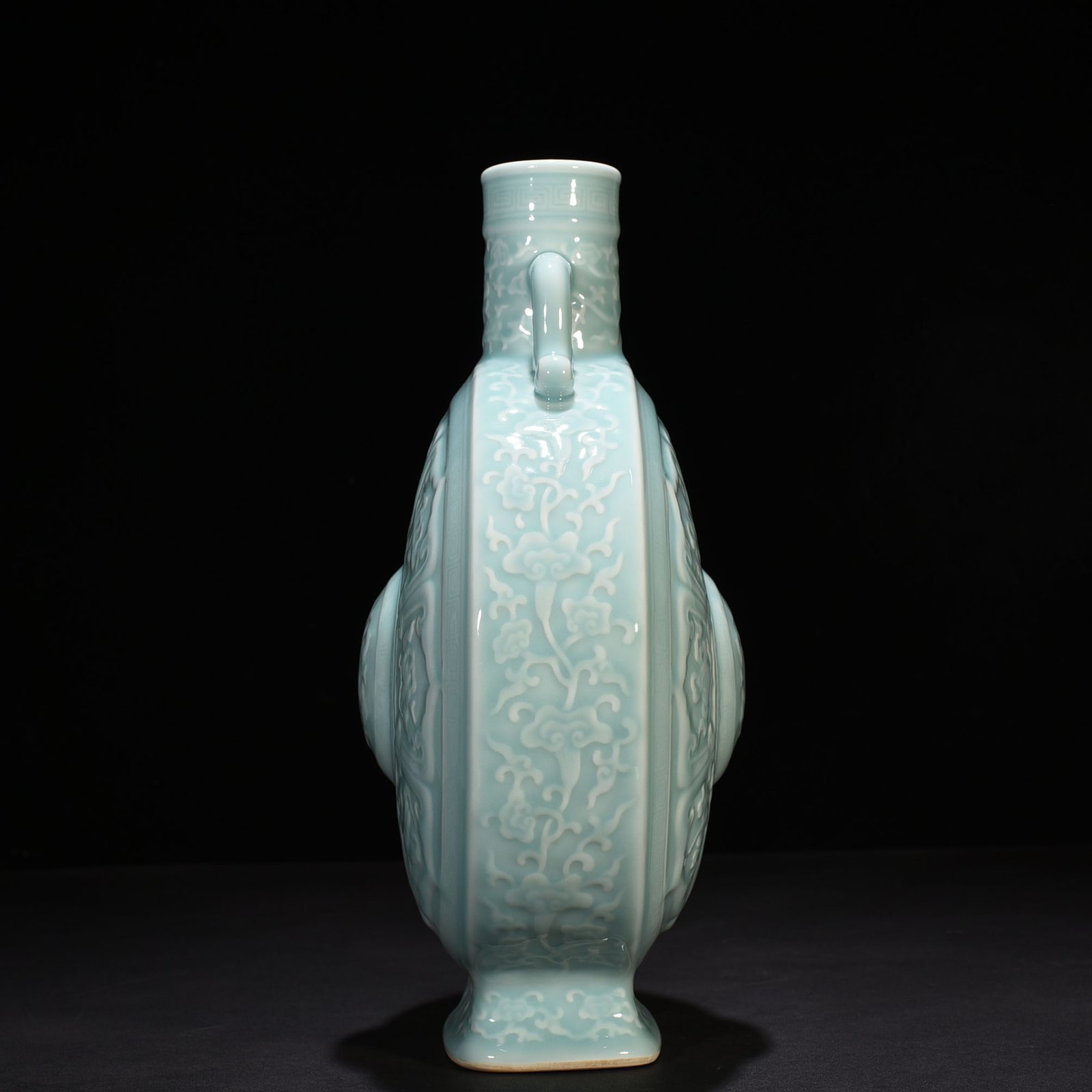 Qing Dynasty Qianlong pink celadon glaze carved eight-treasure pattern moon bottle flat bottle