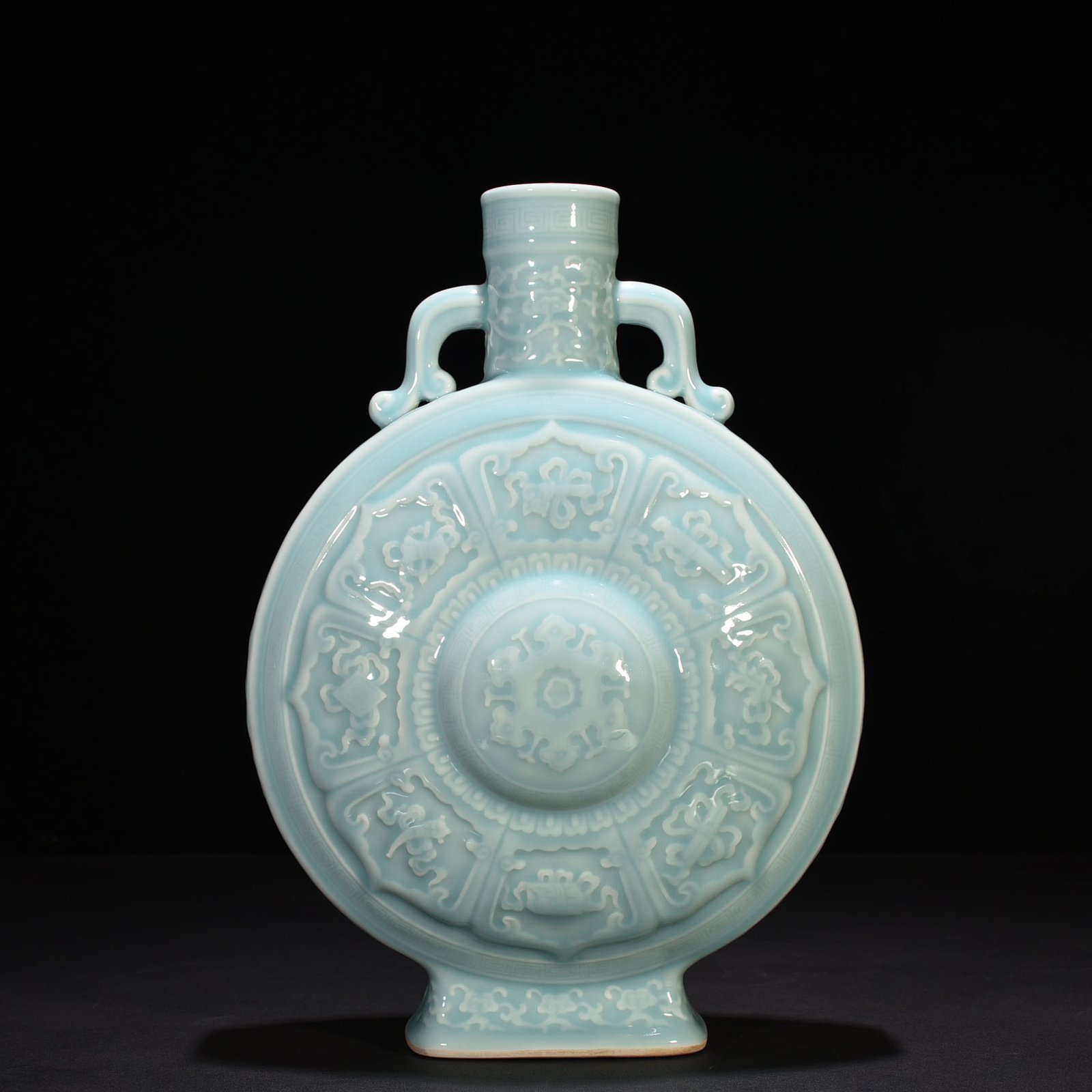 Qing Dynasty Qianlong pink celadon glaze carved eight-treasure pattern moon bottle flat bottle