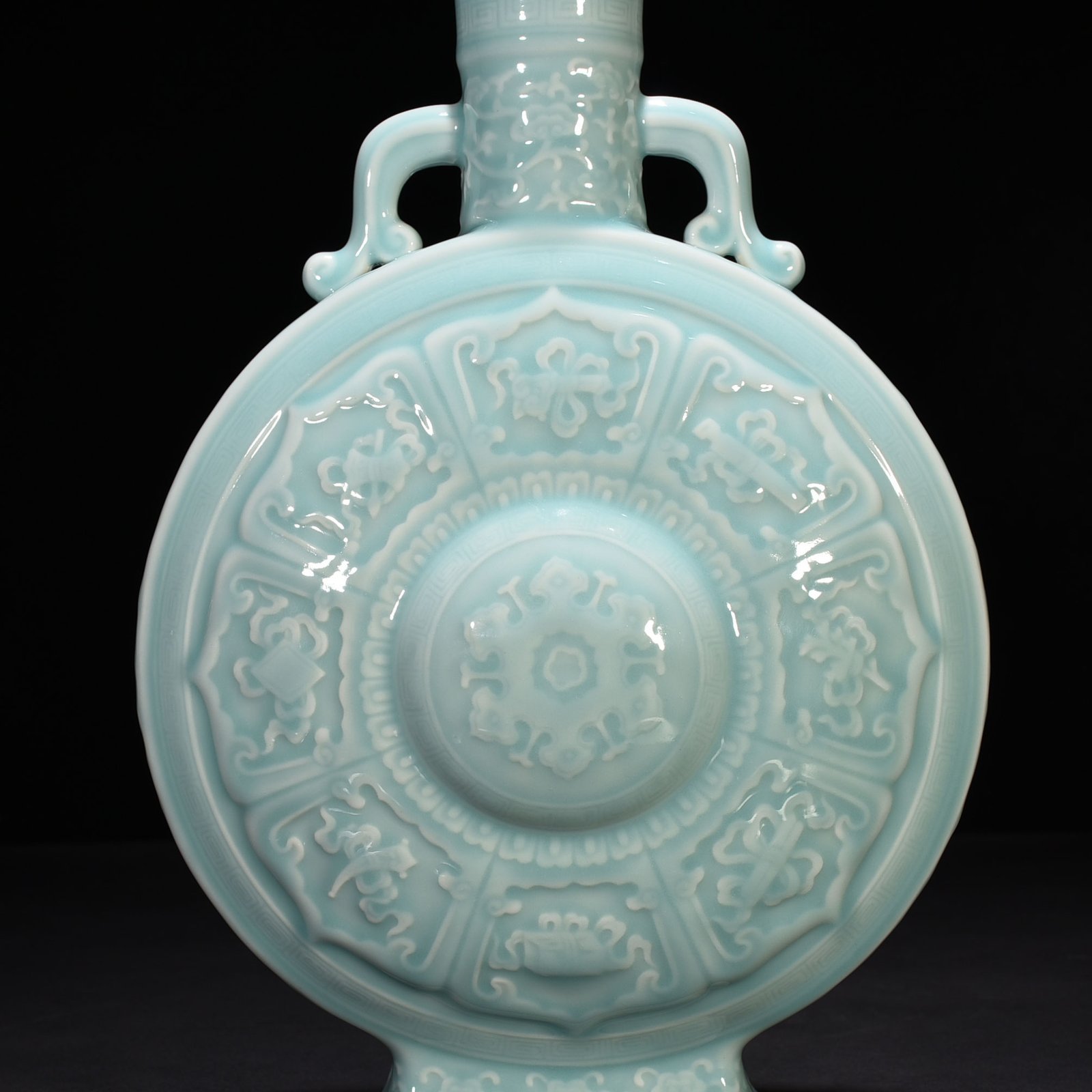 Qing Dynasty Qianlong pink celadon glaze carved eight-treasure pattern moon bottle flat bottle