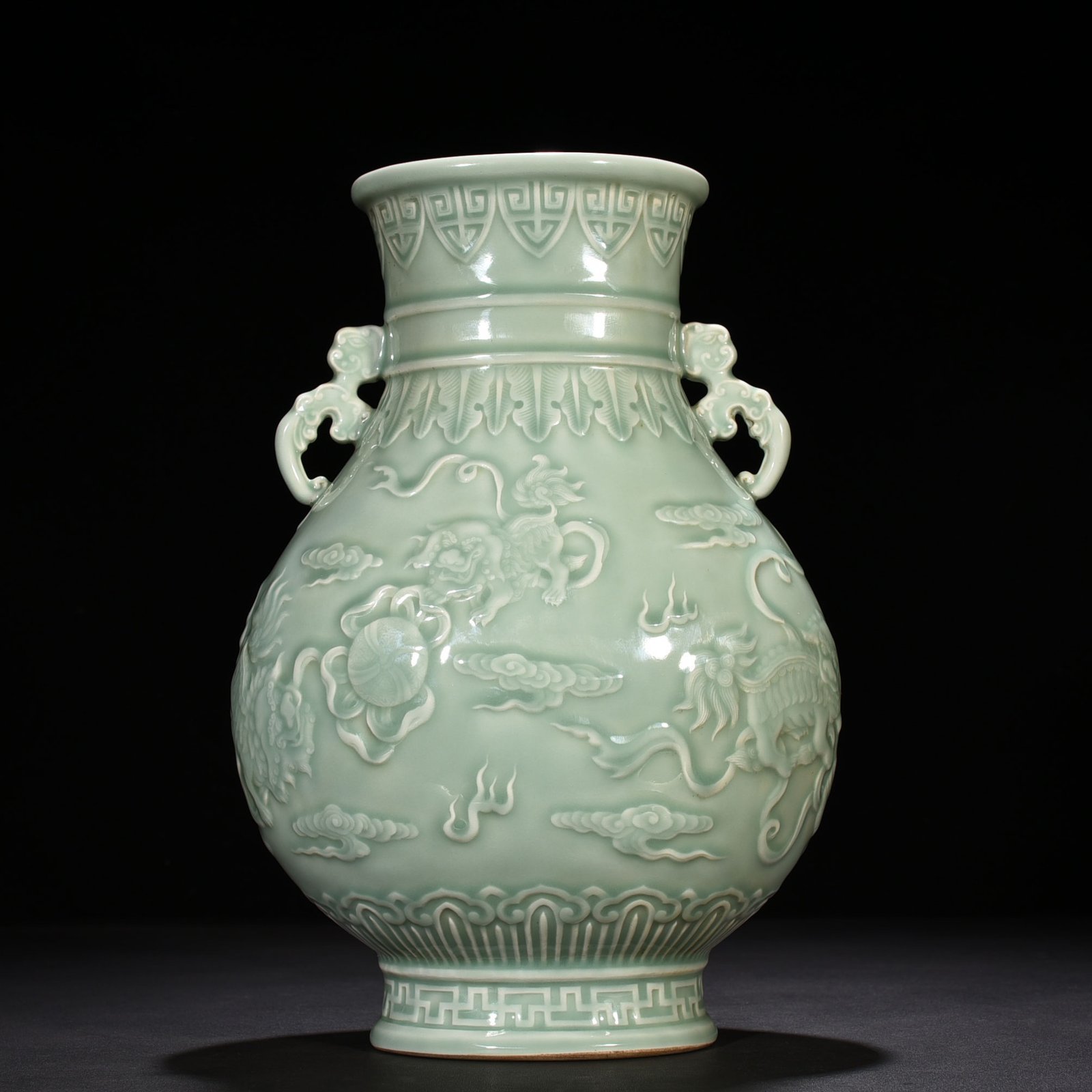 Qing Dynasty Qianlong pink celadon glaze carved lion rolling hydrangea amphora