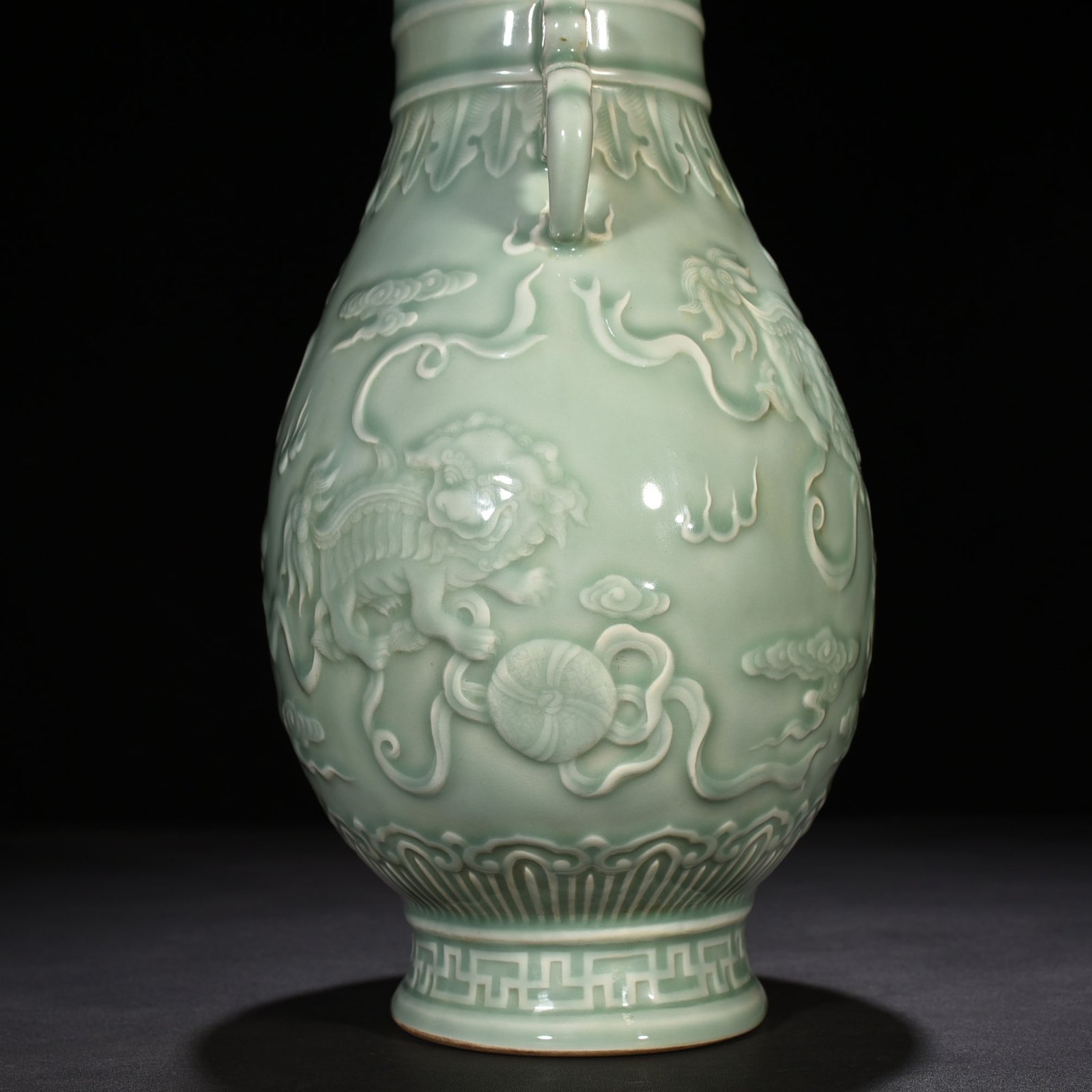 Qing Dynasty Qianlong pink celadon glaze carved lion rolling hydrangea amphora
