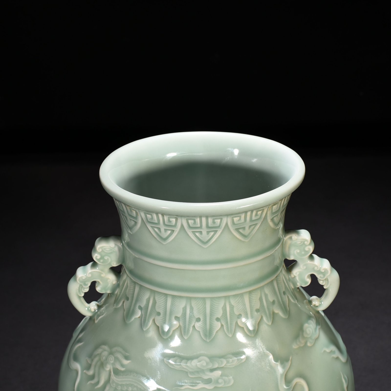 Qing Dynasty Qianlong pink celadon glaze carved lion rolling hydrangea amphora