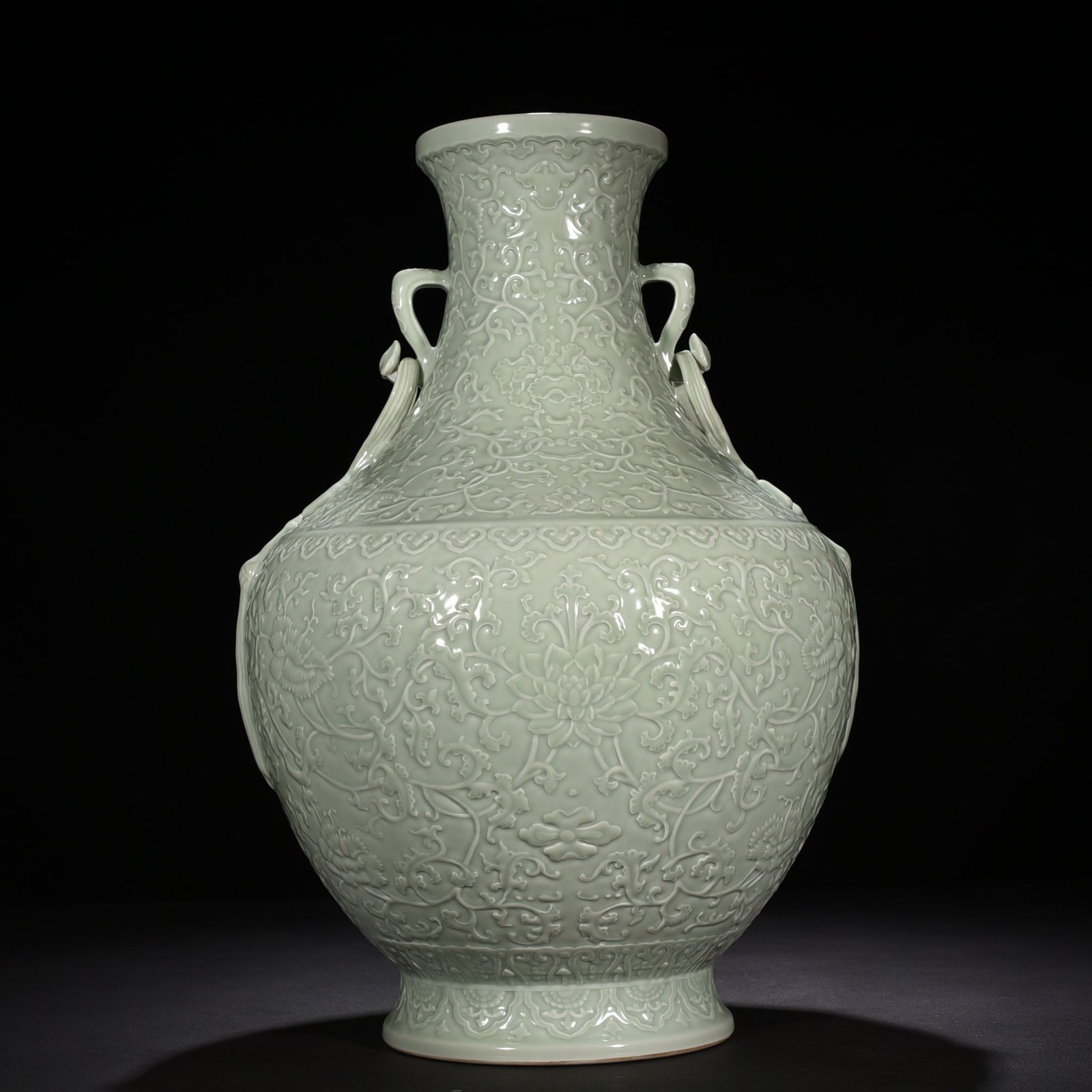 Qing Dynasty Qianlong pink celadon glaze carved tangled flower pattern Ruyi ear vase