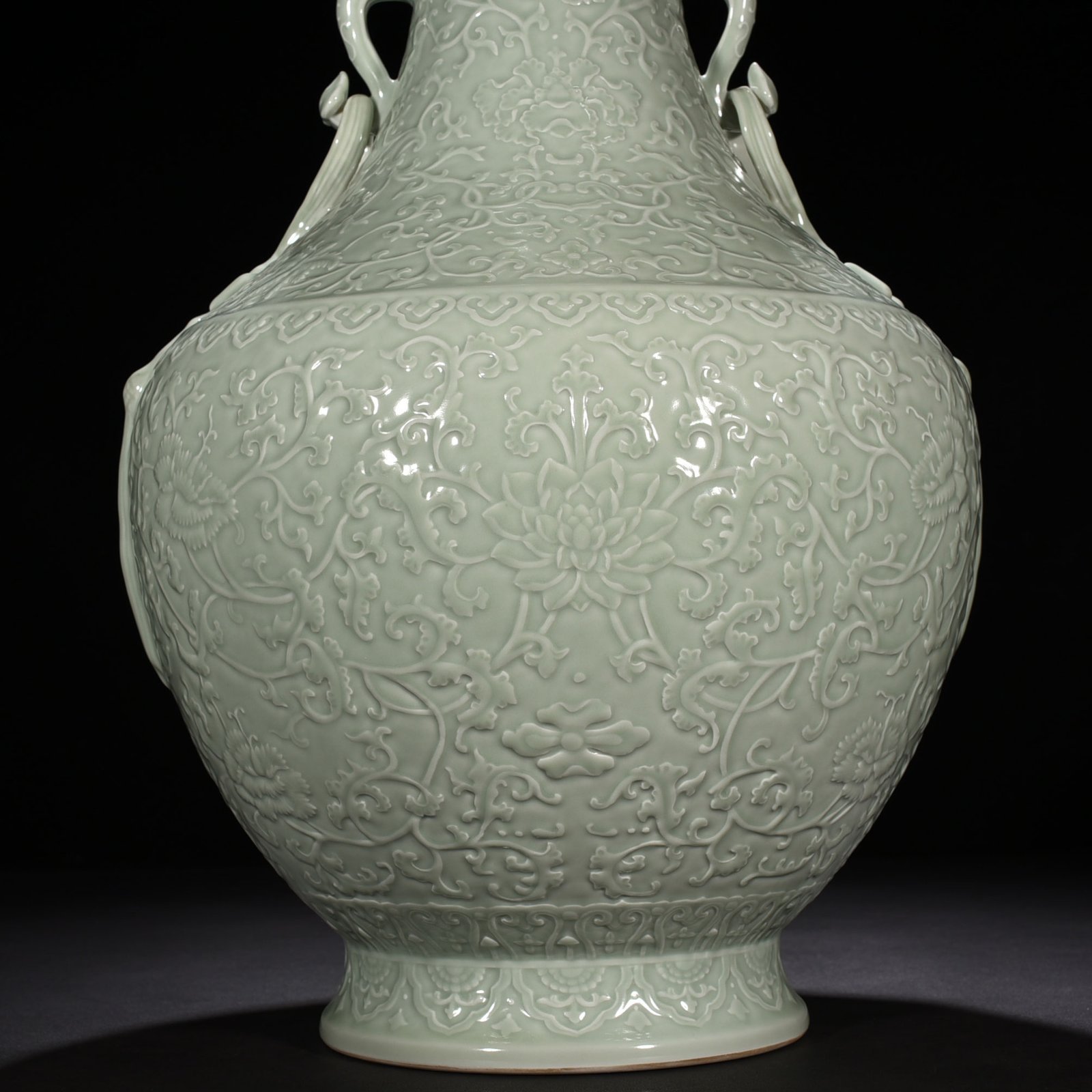 Qing Dynasty Qianlong pink celadon glaze carved tangled flower pattern Ruyi ear vase