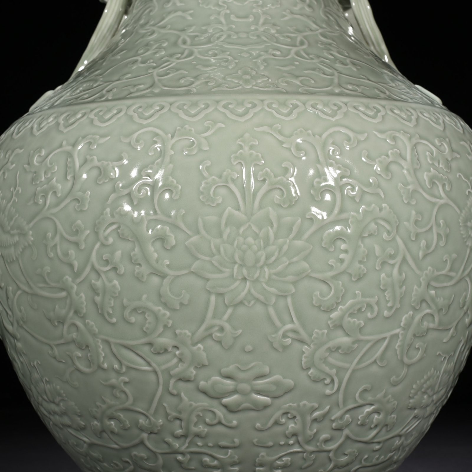 Qing Dynasty Qianlong pink celadon glaze carved tangled flower pattern Ruyi ear vase