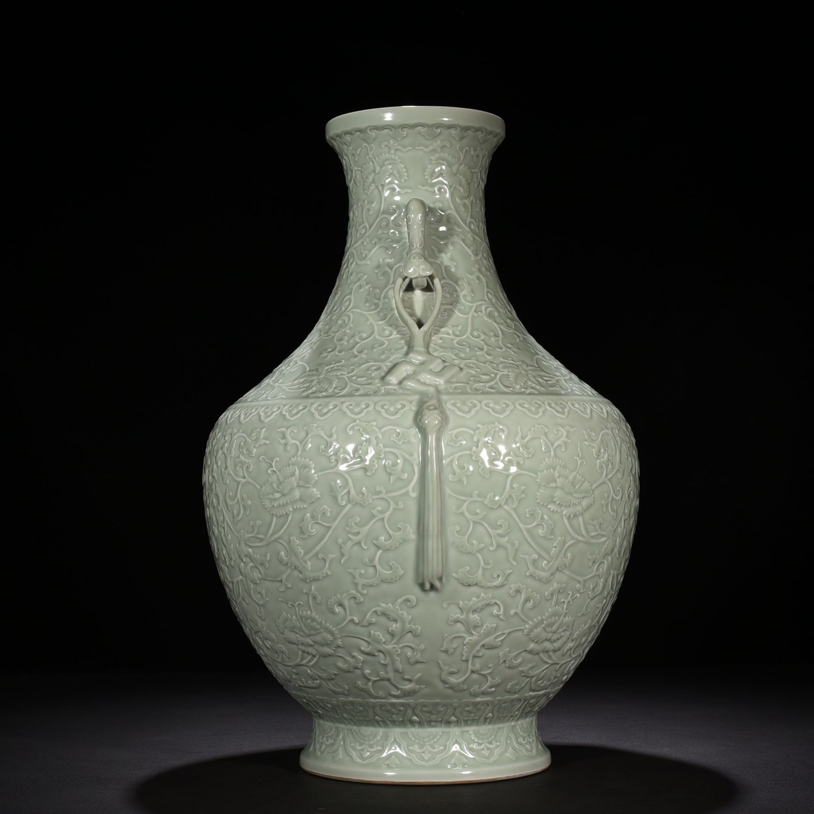 Qing Dynasty Qianlong pink celadon glaze carved tangled flower pattern Ruyi ear vase