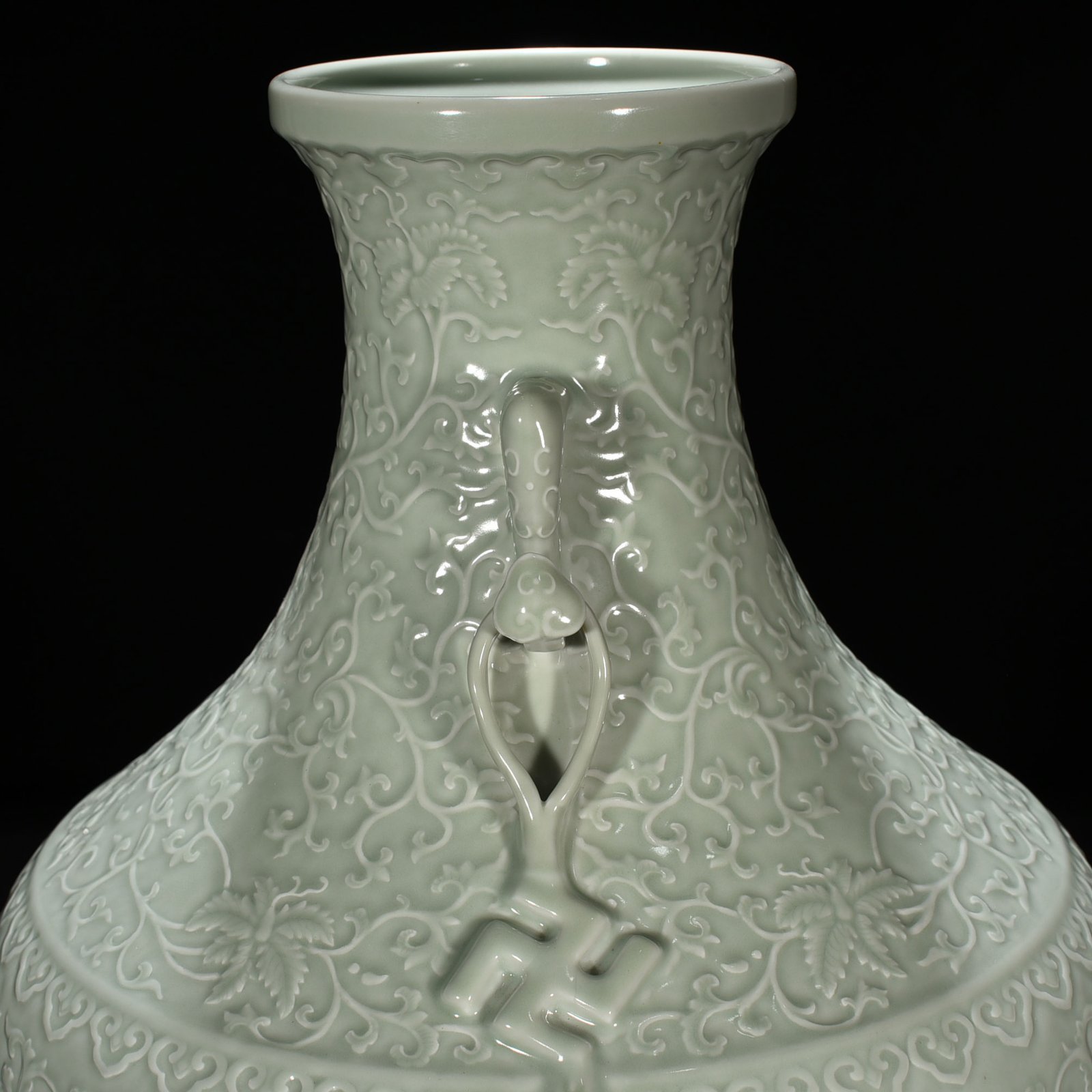 Qing Dynasty Qianlong pink celadon glaze carved tangled flower pattern Ruyi ear vase