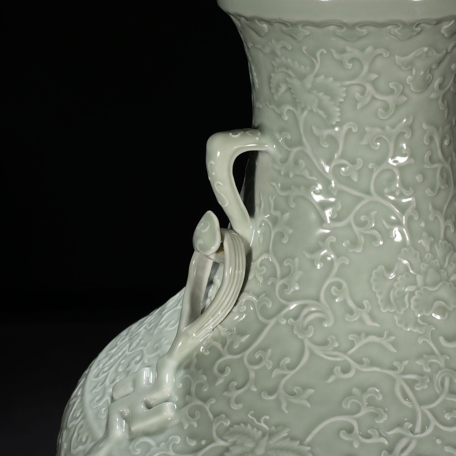 Qing Dynasty Qianlong pink celadon glaze carved tangled flower pattern Ruyi ear vase