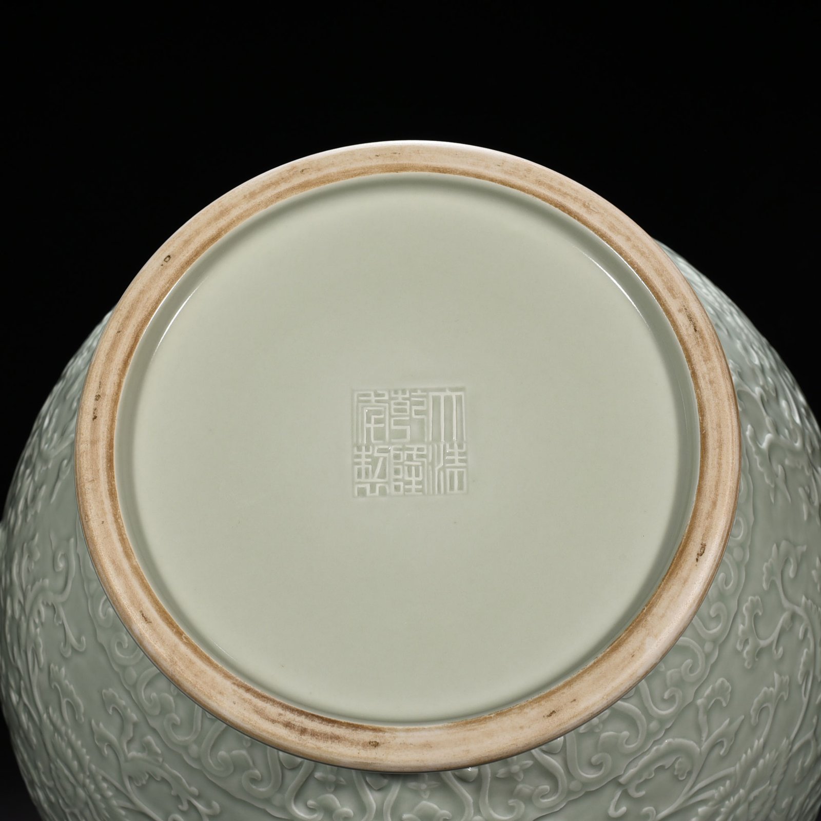 Qing Dynasty Qianlong pink celadon glaze carved tangled flower pattern Ruyi ear vase