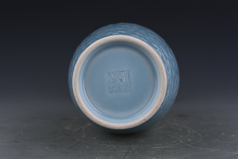 Qing Dynasty Qianlong pink celadon glaze carved flower and peony pattern dish bottle