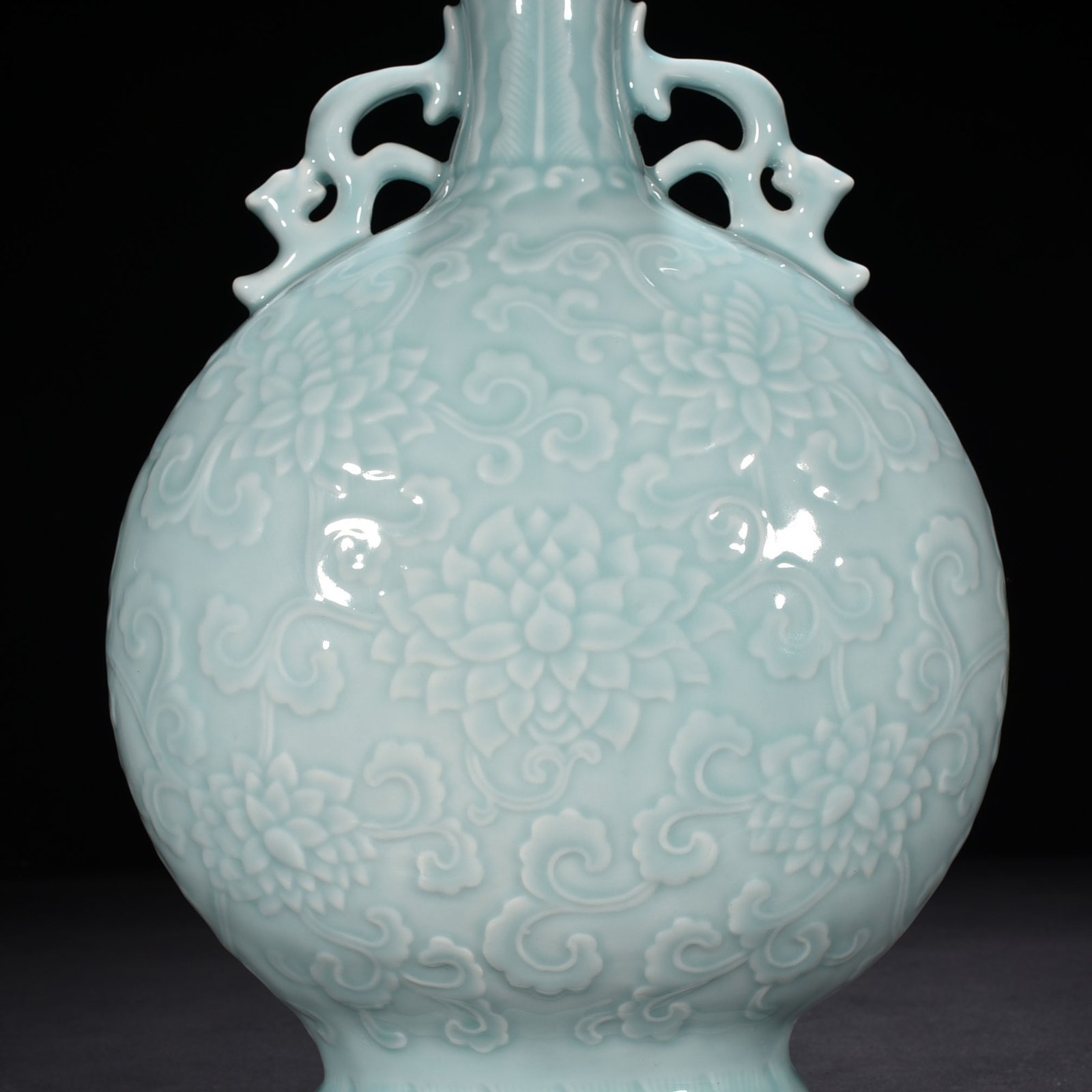 Qing Dynasty Qianlong pink celadon glaze flat vase with carved floral patterns