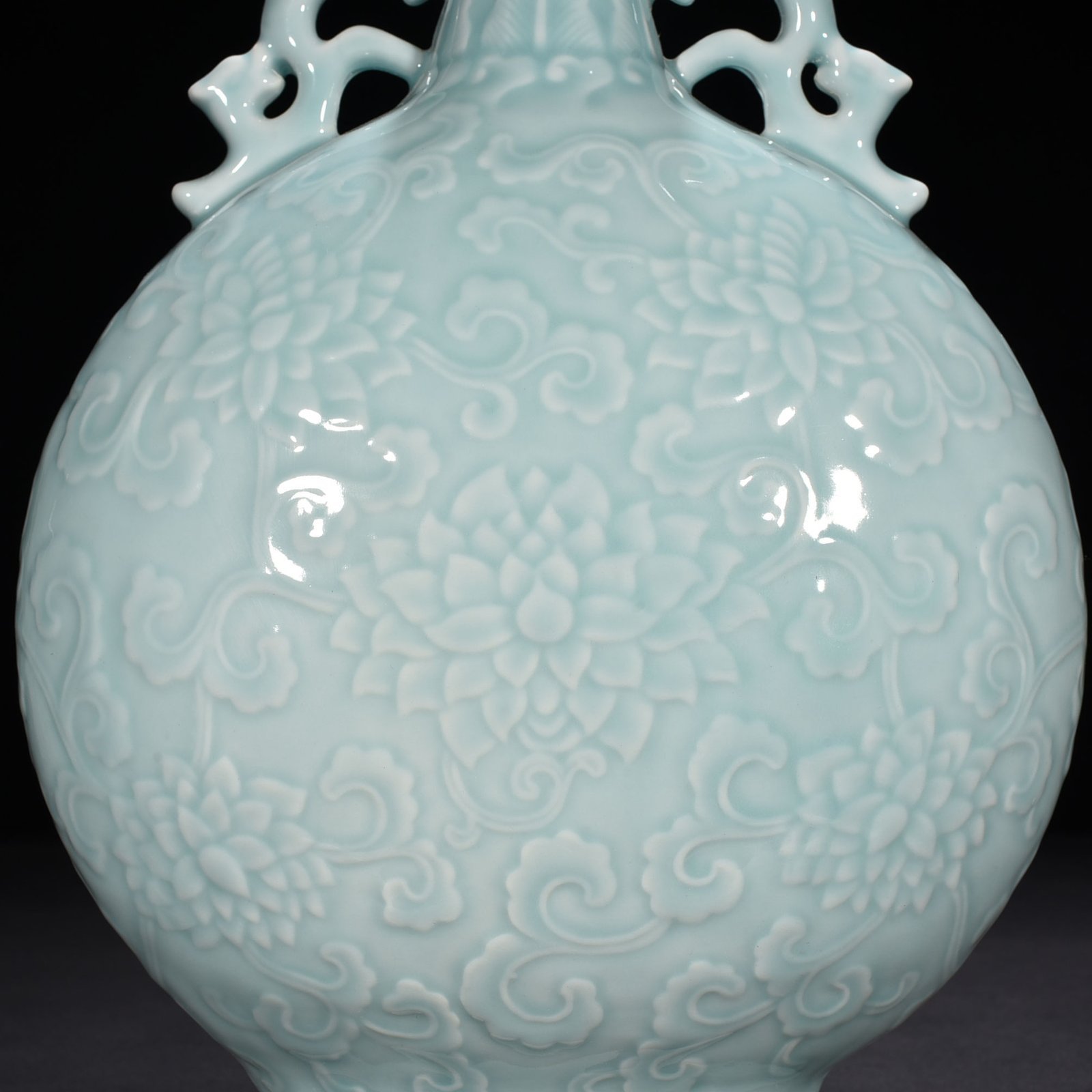 Qing Dynasty Qianlong pink celadon glaze flat vase with carved floral patterns