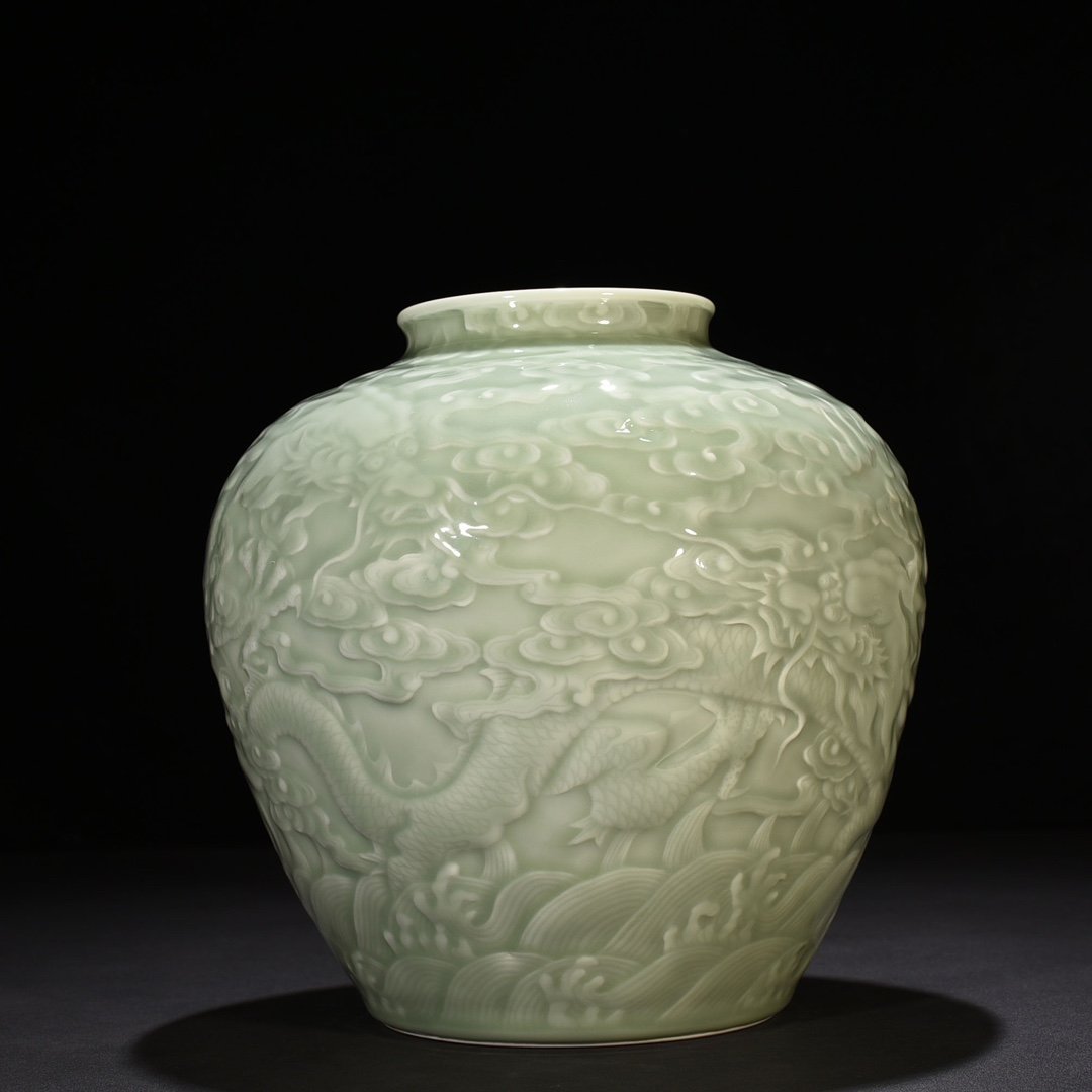 Qing Dynasty Qianlong pink celadon glaze carved Canglong godson jar