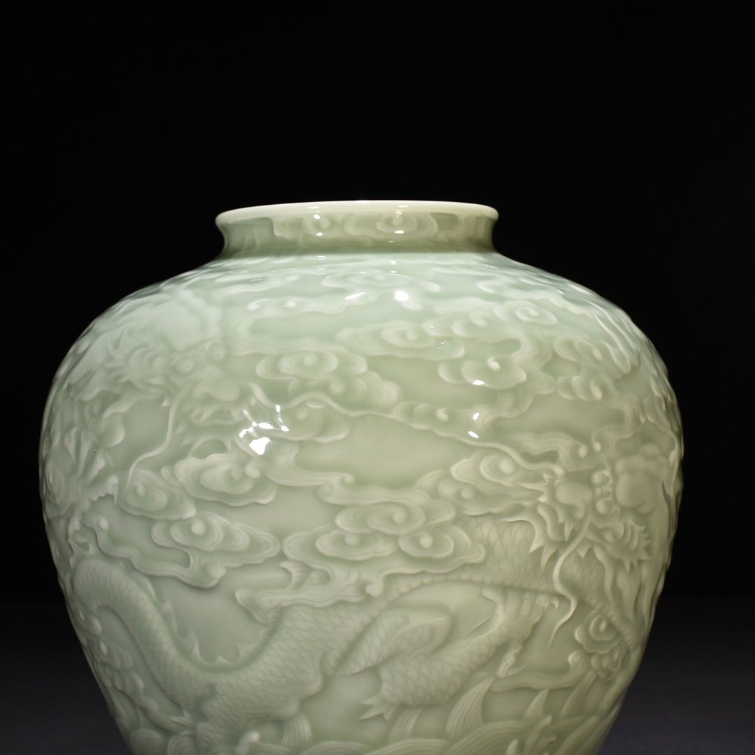 Qing Dynasty Qianlong pink celadon glaze carved Canglong godson jar