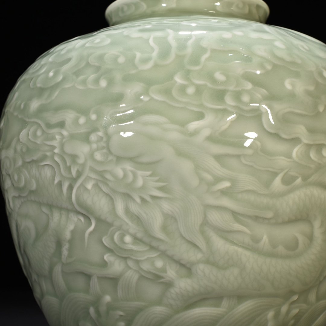 Qing Dynasty Qianlong pink celadon glaze carved Canglong godson jar