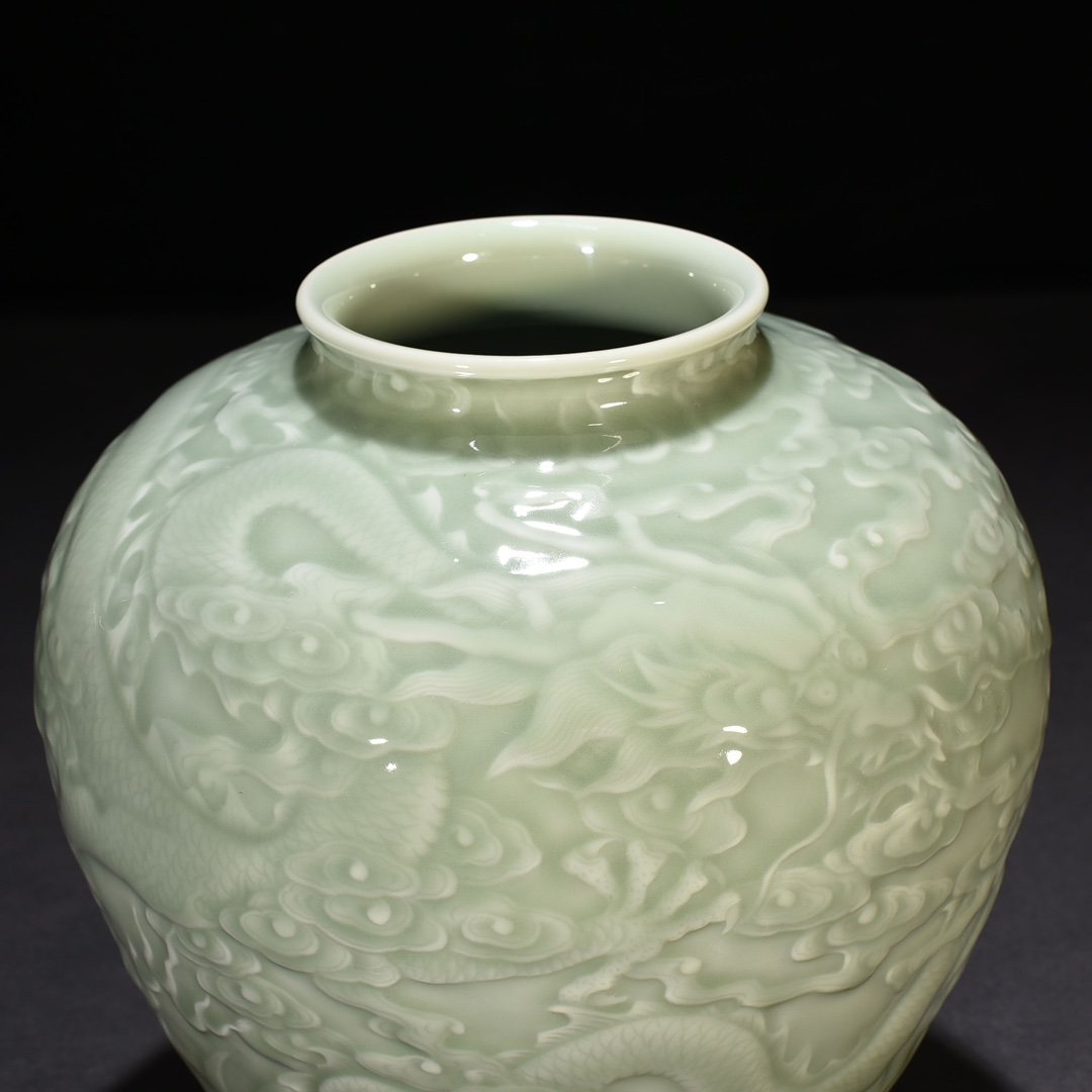 Qing Dynasty Qianlong pink celadon glaze carved Canglong godson jar