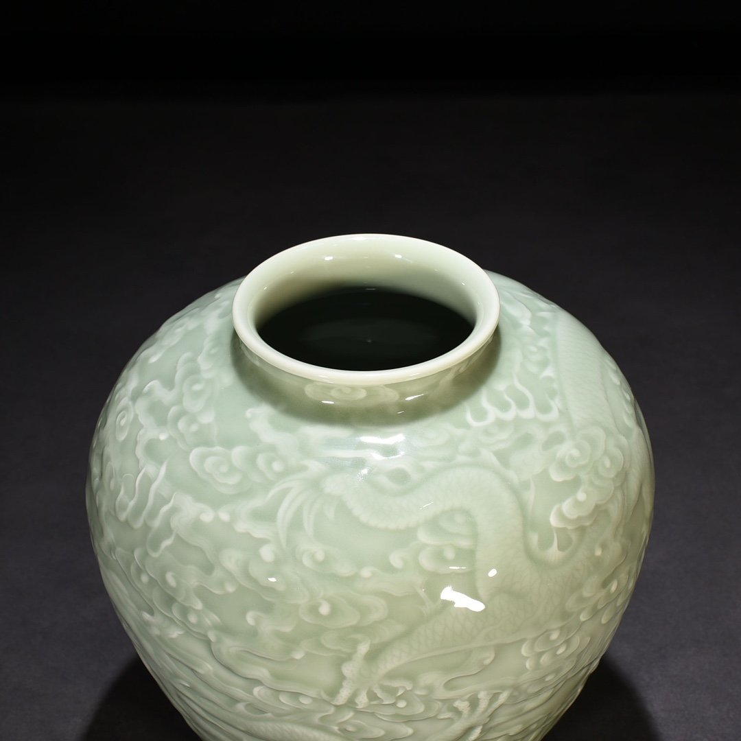 Qing Dynasty Qianlong pink celadon glaze carved Canglong godson jar