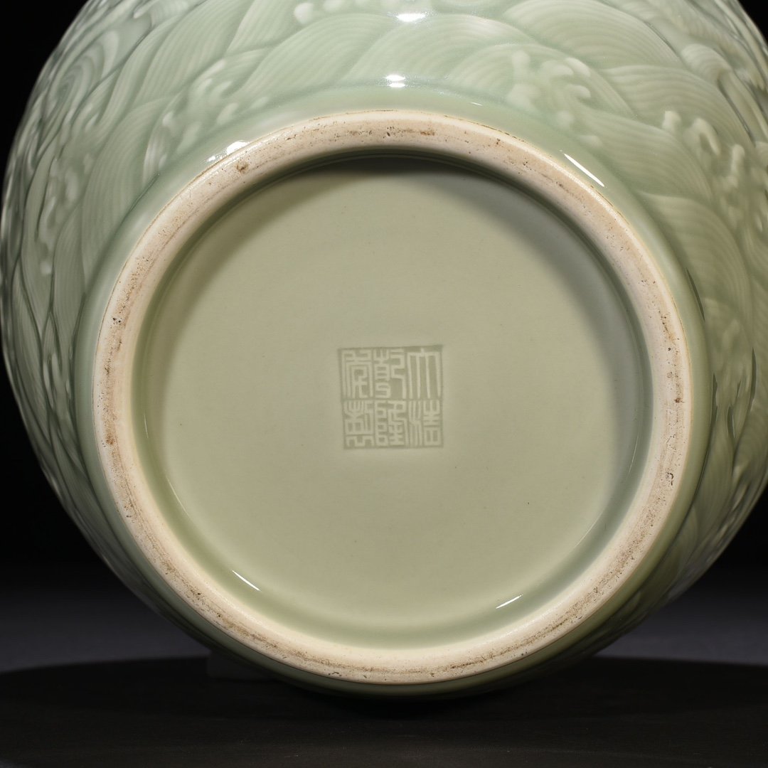 Qing Dynasty Qianlong pink celadon glaze carved Canglong godson jar