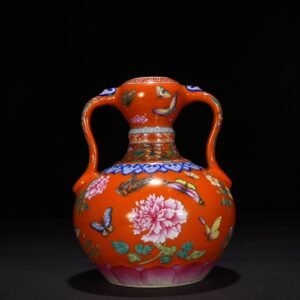 Qing Dynasty Qianlong red ground pastel butterfly love pattern Ruyi ear garlic vase