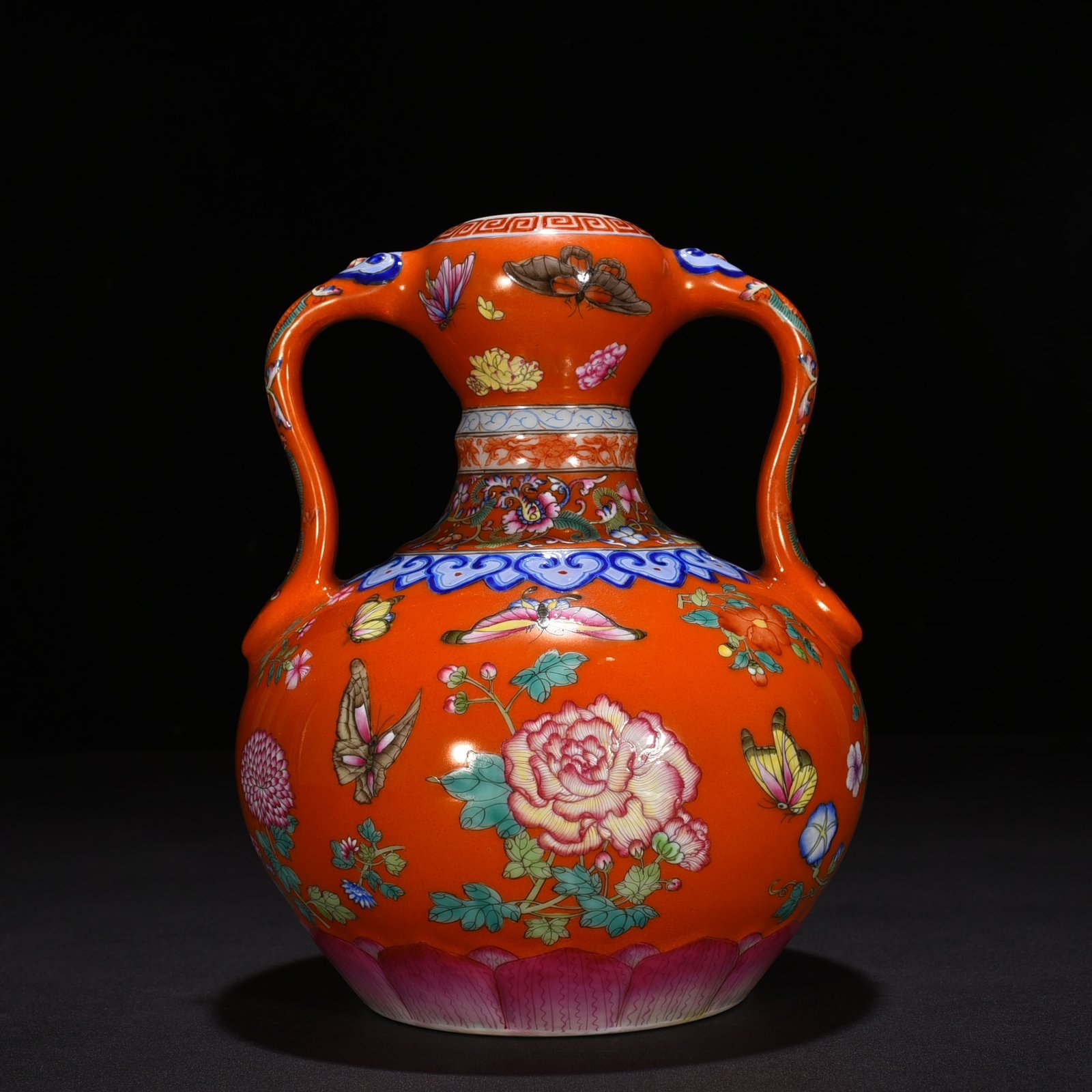Qing Dynasty Qianlong red ground pastel butterfly love pattern Ruyi ear garlic vase