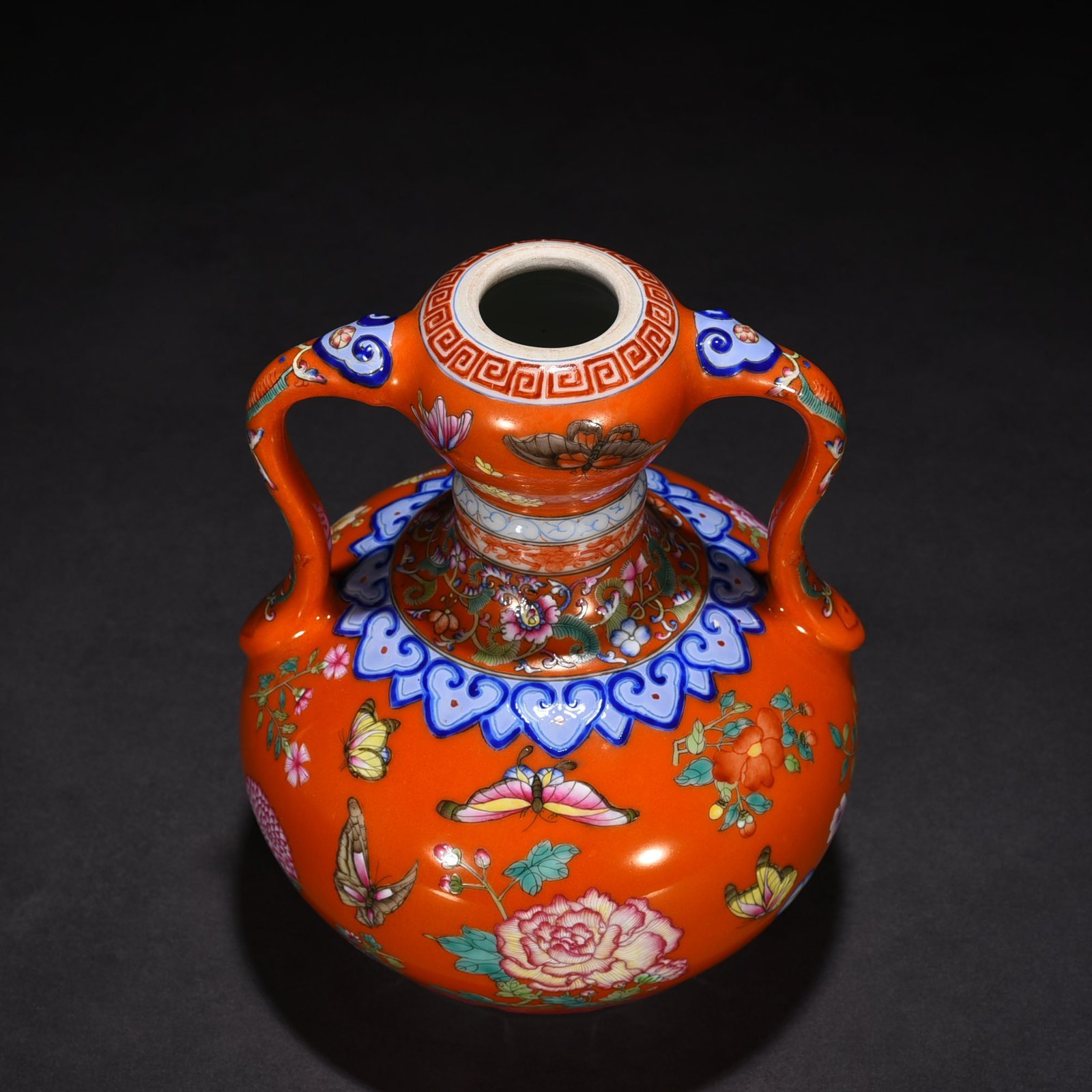 Qing Dynasty Qianlong red ground pastel butterfly love pattern Ruyi ear garlic vase
