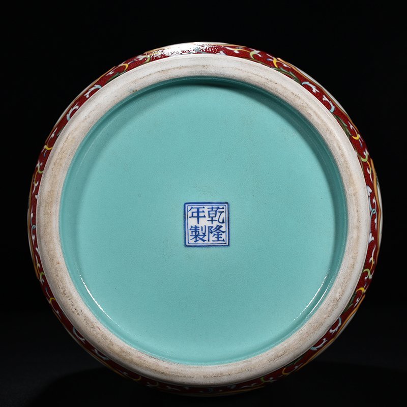 Qing Dynasty Qianlong red ground rolling road consecrated four seasons flower verse pattern vase