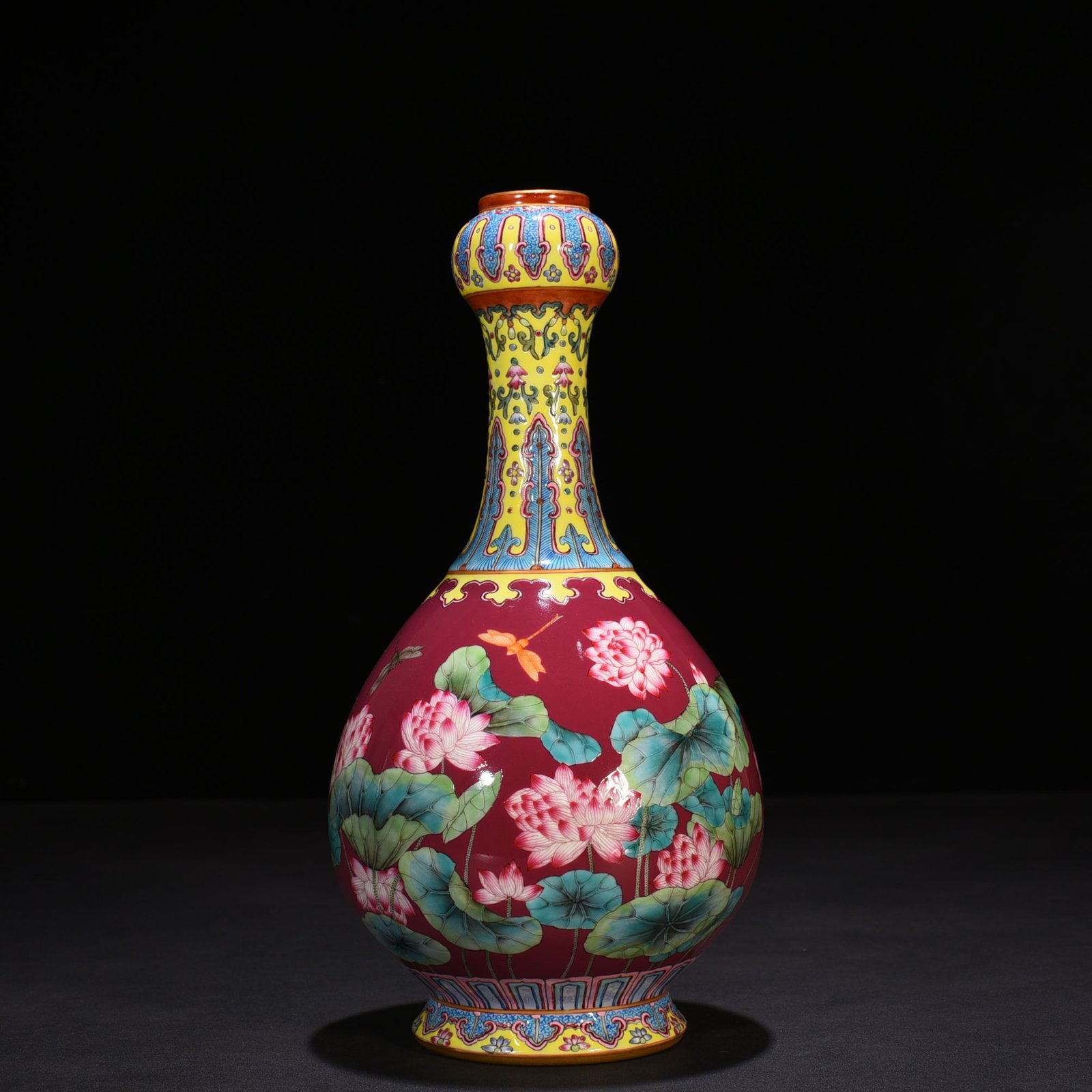Qing Dynasty Qianlong rouge red ground enamel garlic vase with lotus pattern