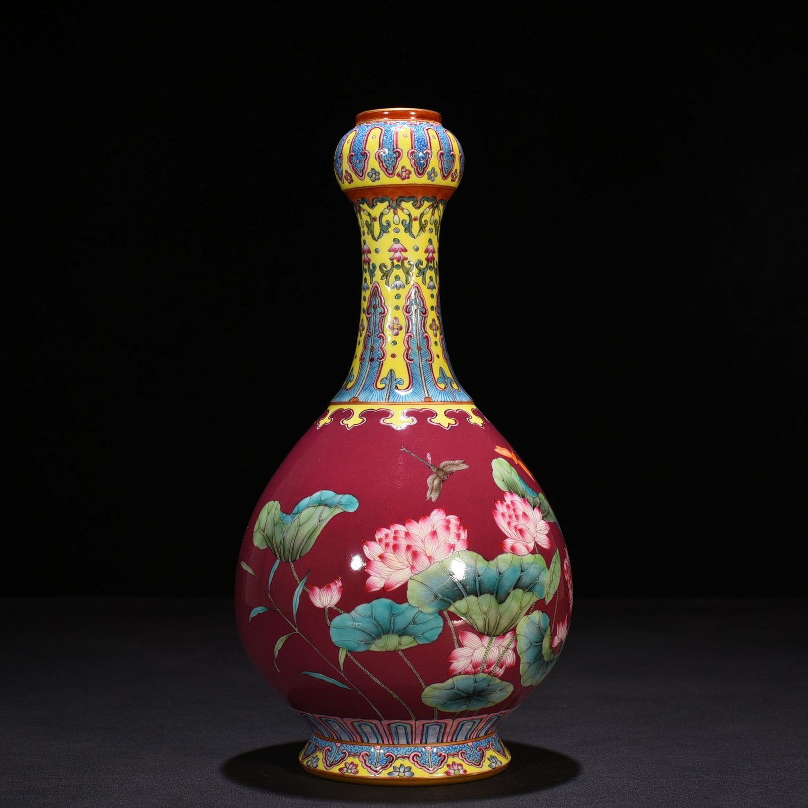 Qing Dynasty Qianlong rouge red ground enamel garlic vase with lotus pattern