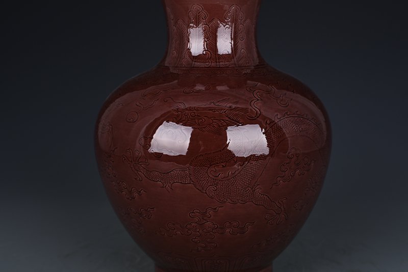 Qing Dynasty Qianlong eggplant skin purple glaze bottle with hidden dragon
