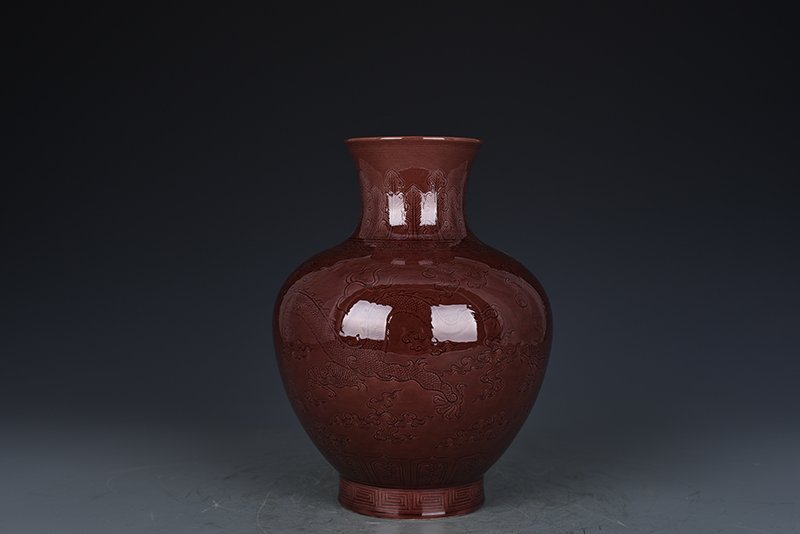 Qing Dynasty Qianlong eggplant skin purple glaze bottle with hidden dragon