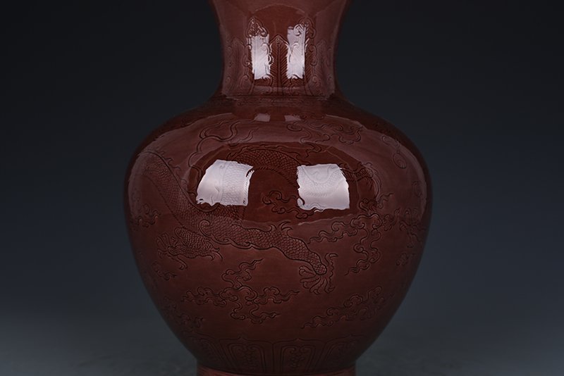 Qing Dynasty Qianlong eggplant skin purple glaze bottle with hidden dragon