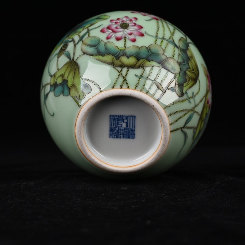 Qing Dynasty Qianlong bean green glaze pastel lotus pattern apple statue
