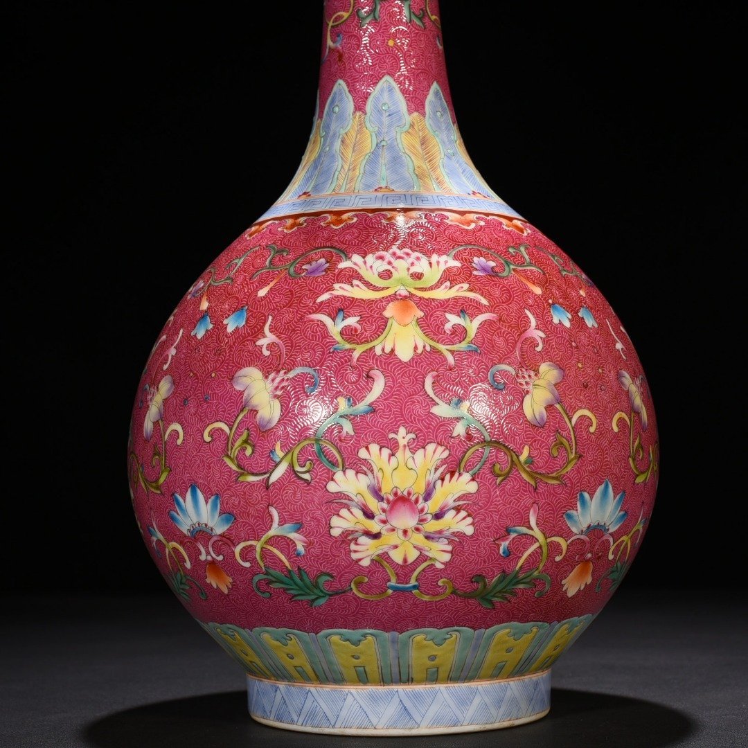 Qing Dynasty Qianlong rolling rouge ground pastel flower vase