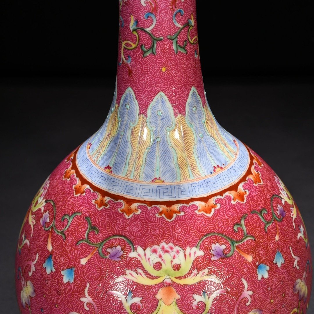 Qing Dynasty Qianlong rolling rouge ground pastel flower vase