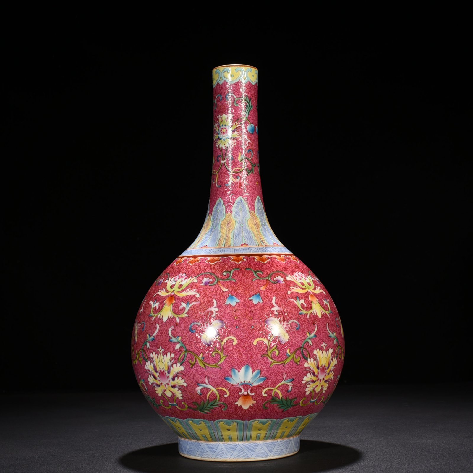 Qing Dynasty Qianlong rolling rouge ground pastel flower vase