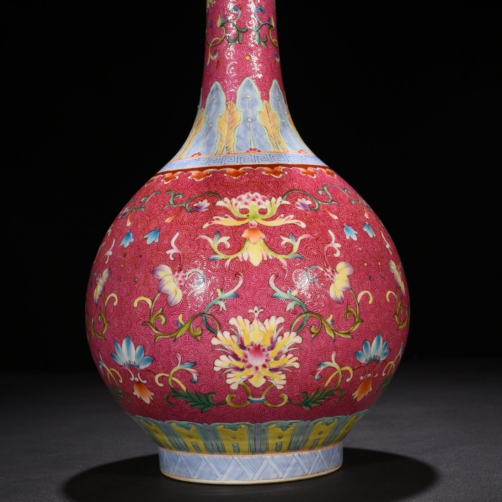 Qing Dynasty Qianlong rolling rouge ground pastel flower vase