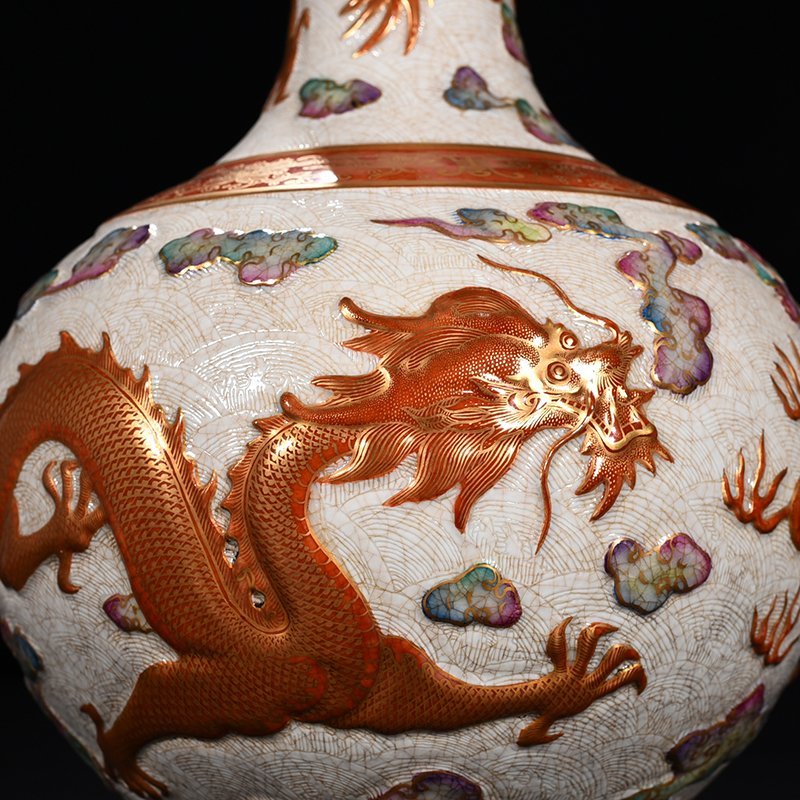 Qing Dynasty Qianlong carved rolled sea alum red vase