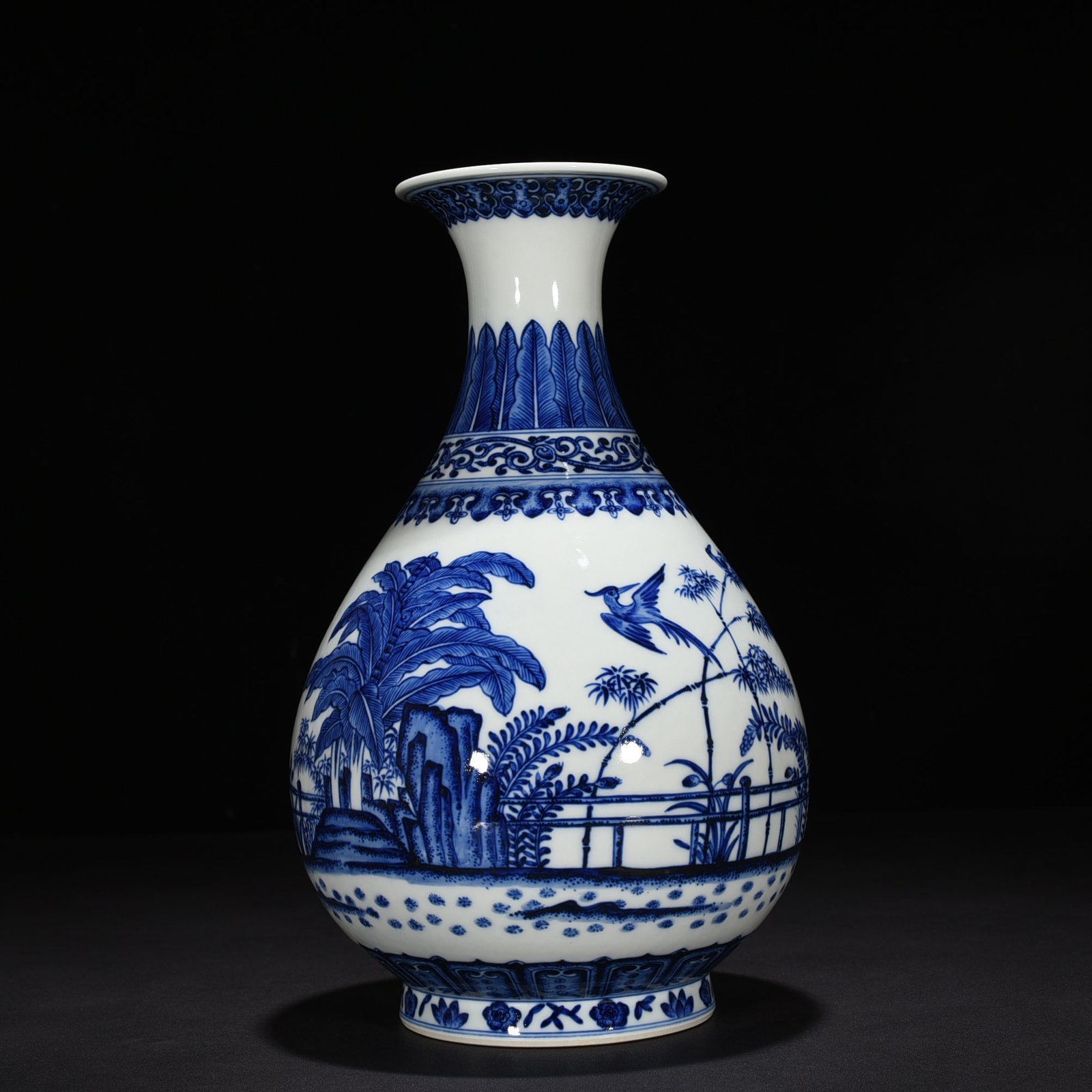 Qing Dynasty Qianlong blue and white courtyard bamboo stone banana pattern jade pot spring vase