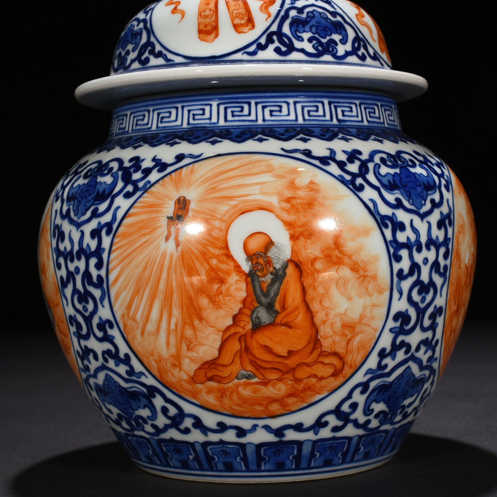 Qing Dynasty Qianlong blue and white windowed alum red Arhat pattern general jar