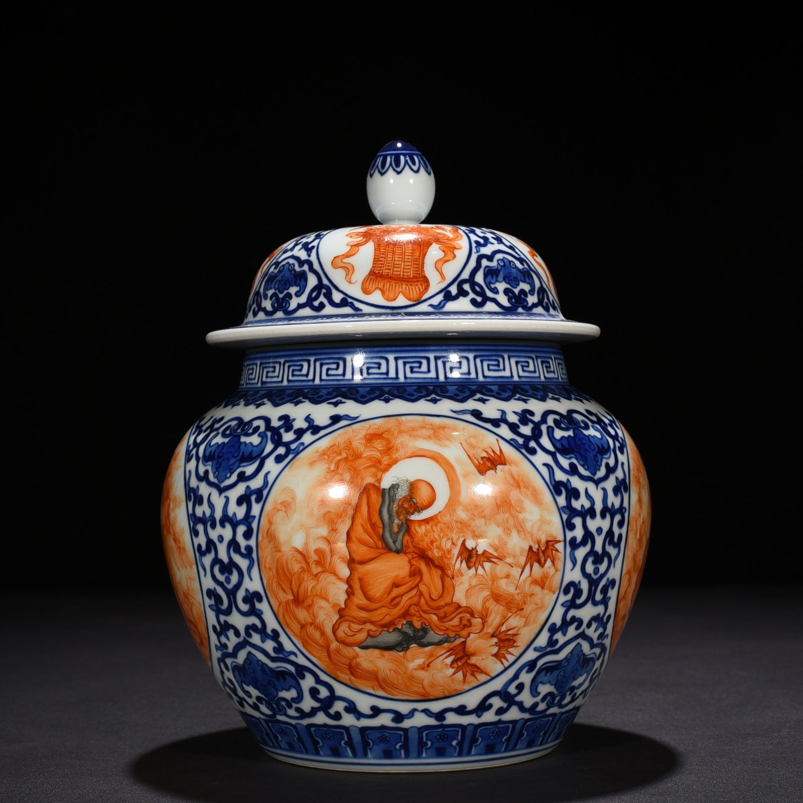Qing Dynasty Qianlong blue and white windowed alum red Arhat pattern general jar