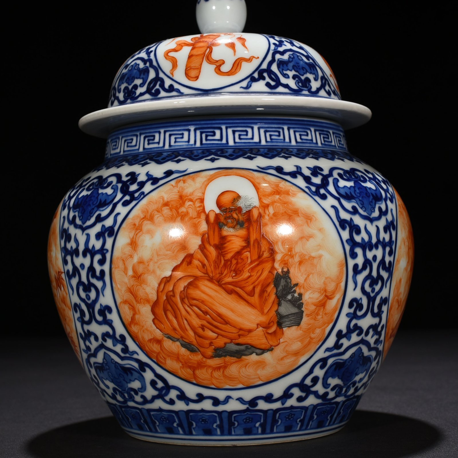 Qing Dynasty Qianlong blue and white windowed alum red Arhat pattern general jar