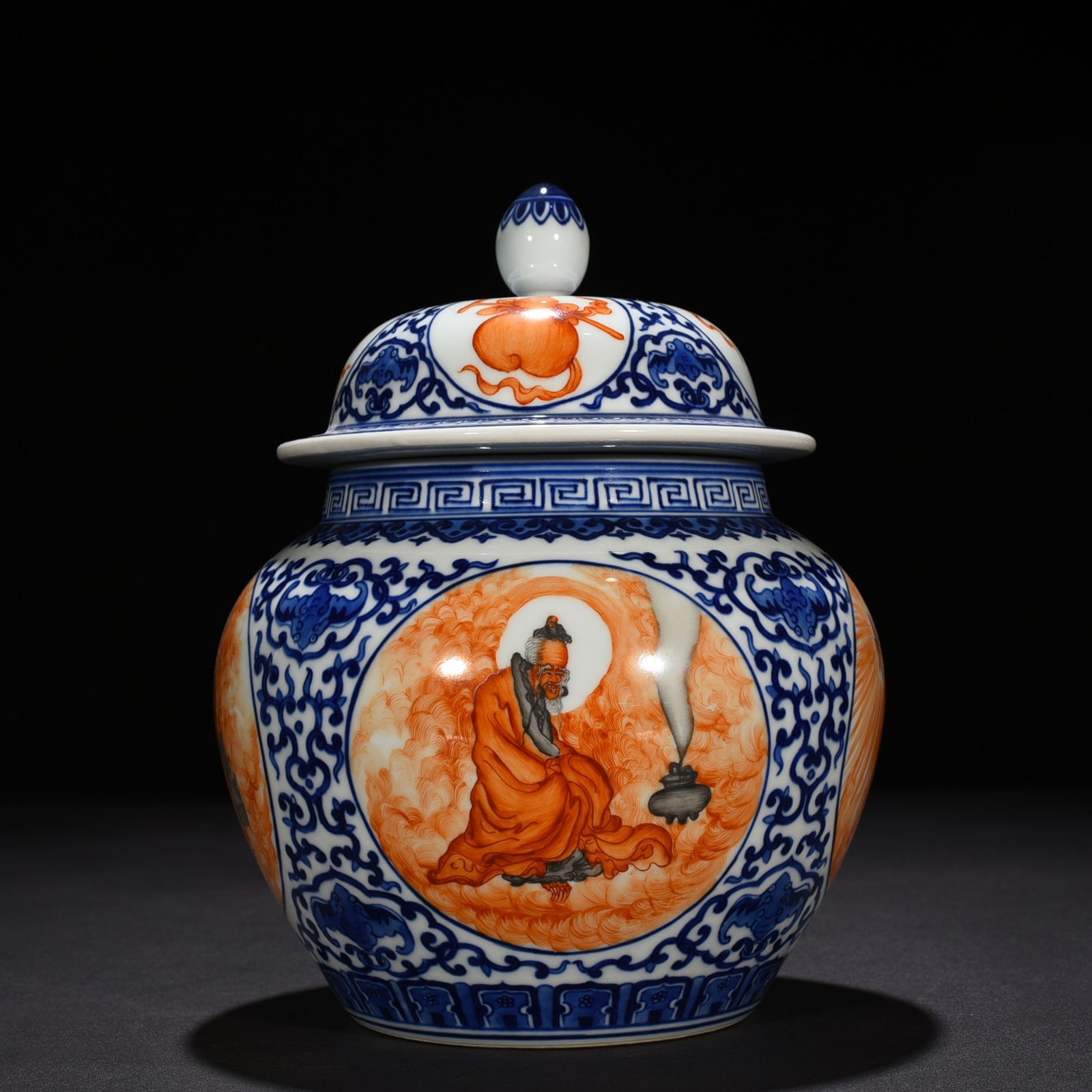 Qing Dynasty Qianlong blue and white windowed alum red Arhat pattern general jar
