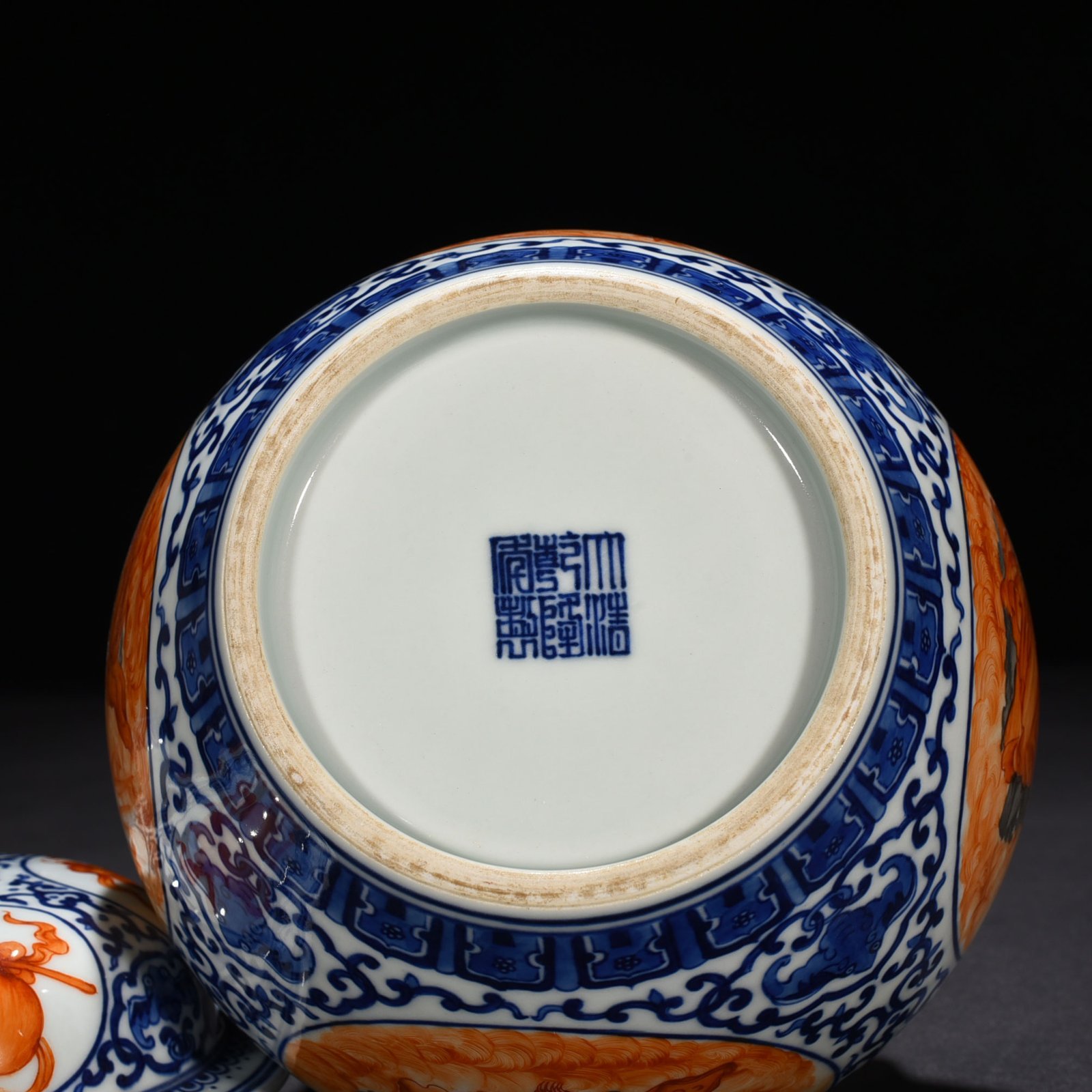 Qing Dynasty Qianlong blue and white windowed alum red Arhat pattern general jar