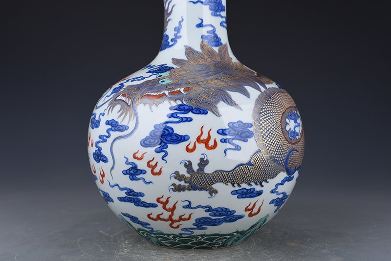 Qing Dynasty Qianlong blue and white celestial sphere vase with gold cloud and dragon