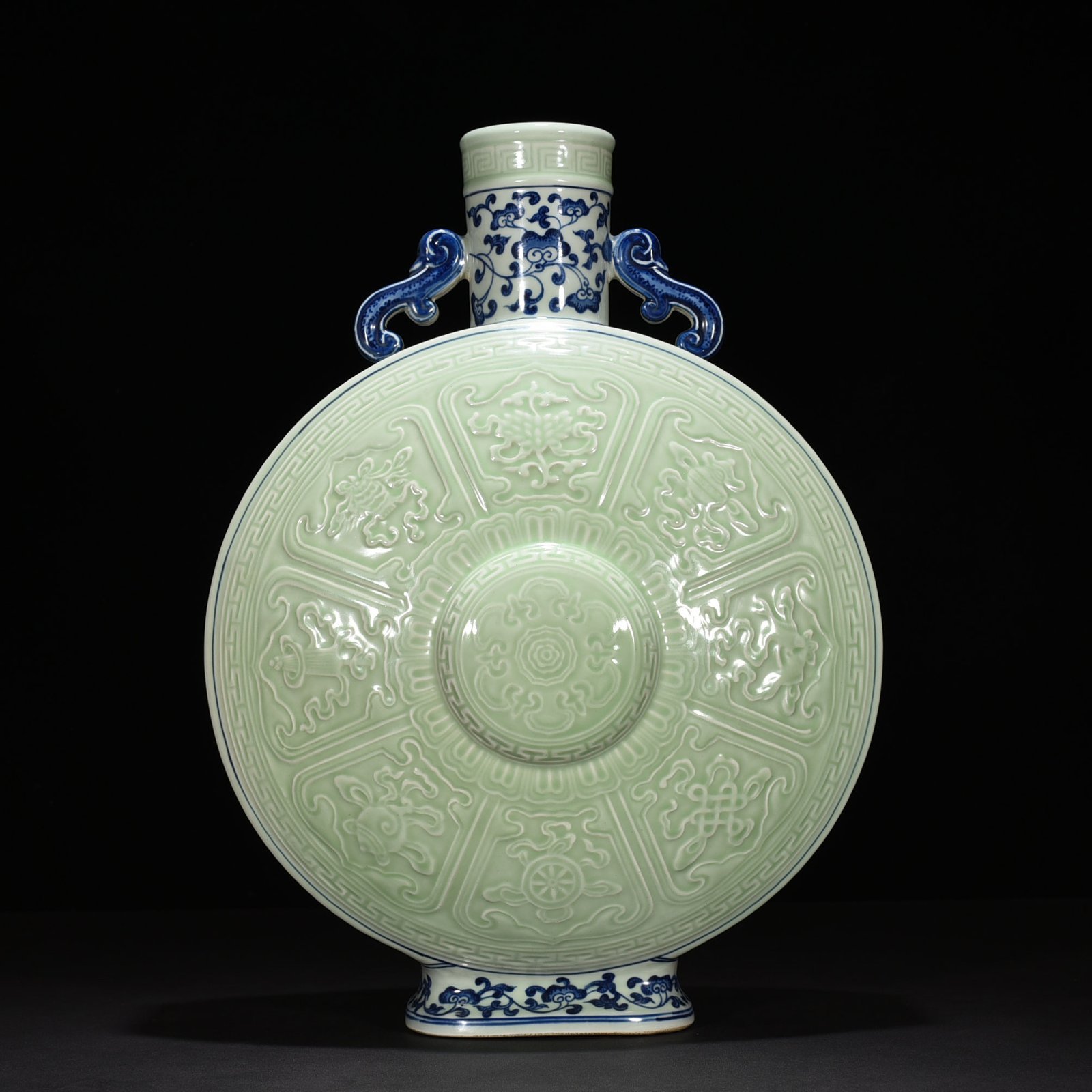 Qing Dynasty Qianlong blue and white bean green glaze carved Buddhist eight-treasure pattern moon vase